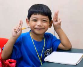 Dereck, all smiles inside his Payatas C classroom