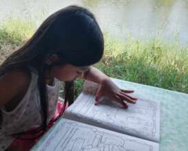 A young girl with her tailor-fitted learning kits