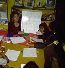 Girls learning to read and write in Maya language