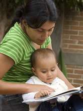 Mom Reading With Baby
