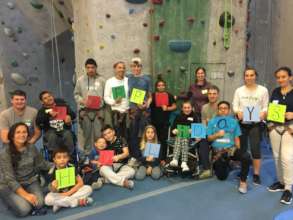 Groups of rock climbers saying "happy holidays!"