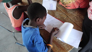 Children designing murals for the inside walls