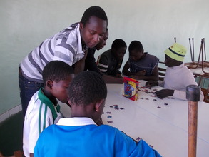 Collen working with kids on puzzles