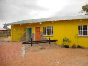 Exterior featuring our alphabet gate made by Peter