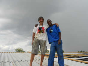 Dennis and Foster assembling roof on Resource Cntr