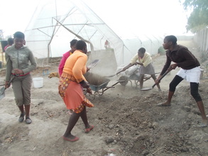Girls  preparing for another crop in greenhouse