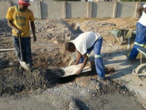 Hand mixed gravel, sand & cement poured for base