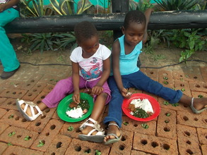 Pauline supervises kitchen &kids enjoy the results