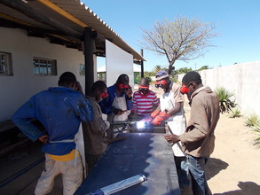 Boys and girls work on first commercial project