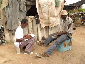 Elder Collen interviewing squatter at dump