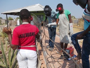 Girls welding railing