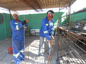 Our girls are welding a client shoe rack.
