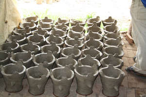 Fuel efficient wood burning clay stoves