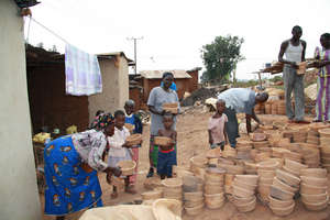 Fuel efficient wood burning clay stoves