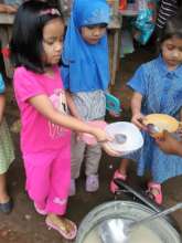 war zone children being fed in elementary school