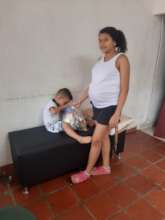 Pregnant woman receiving a bag of food!