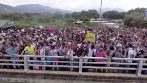 Venezuelan Refugees Crossing Bridge into Colombia
