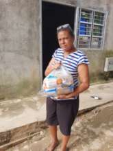 Woman receiving a bag of food!