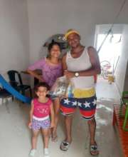 Happy family receiving a bag of food!