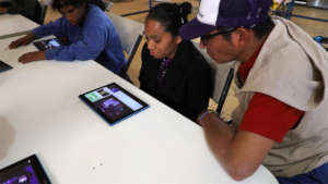 Adults learning with tablets