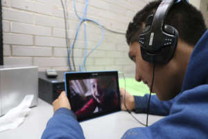 Kid with tablet having a conversation