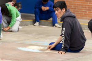 Writing on the floor with crayons