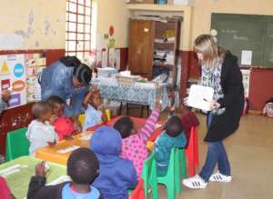 Gillean with local teachers and volunteers in GR