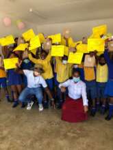 Some Grade 3 students receiving certificates