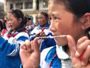 Students learn how to floss.