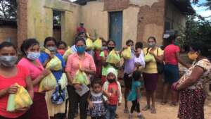 Patients holding their hygiene kits, wearing masks