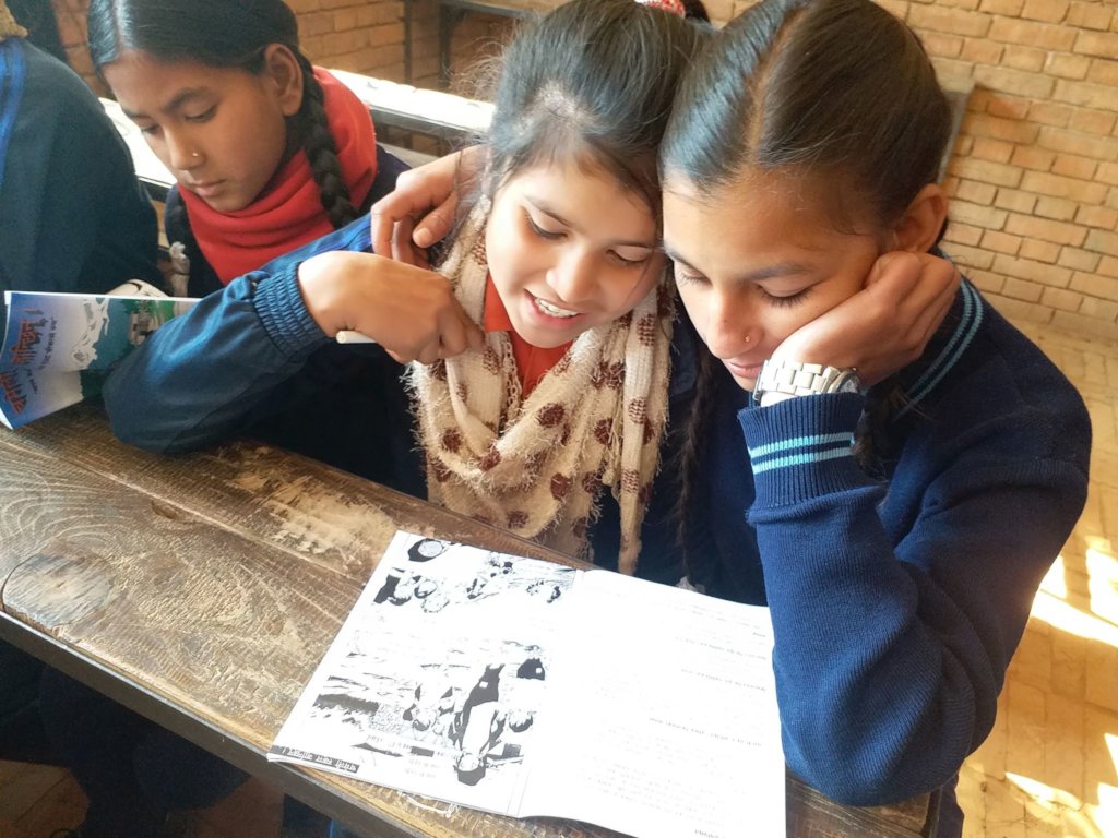 EOSP students read an anti-trafficking comic book