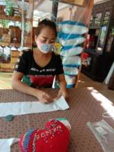 Preparing the fabric to cut for face masks