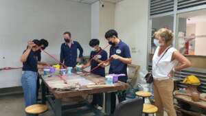Young hill tribe teens learning how to make toys