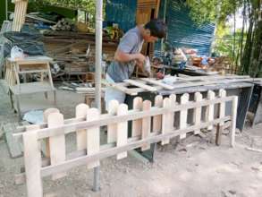 Filling an order for a wooden fence.