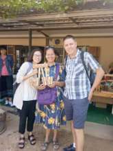 People purchasing a wooden ornament