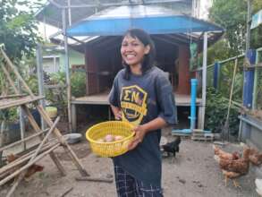 One of our students learning to care for chilckens