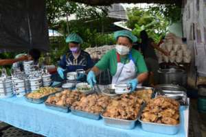 Learning to prepare fresh meals for the hungry.