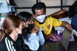 Young ladies learning computing skills