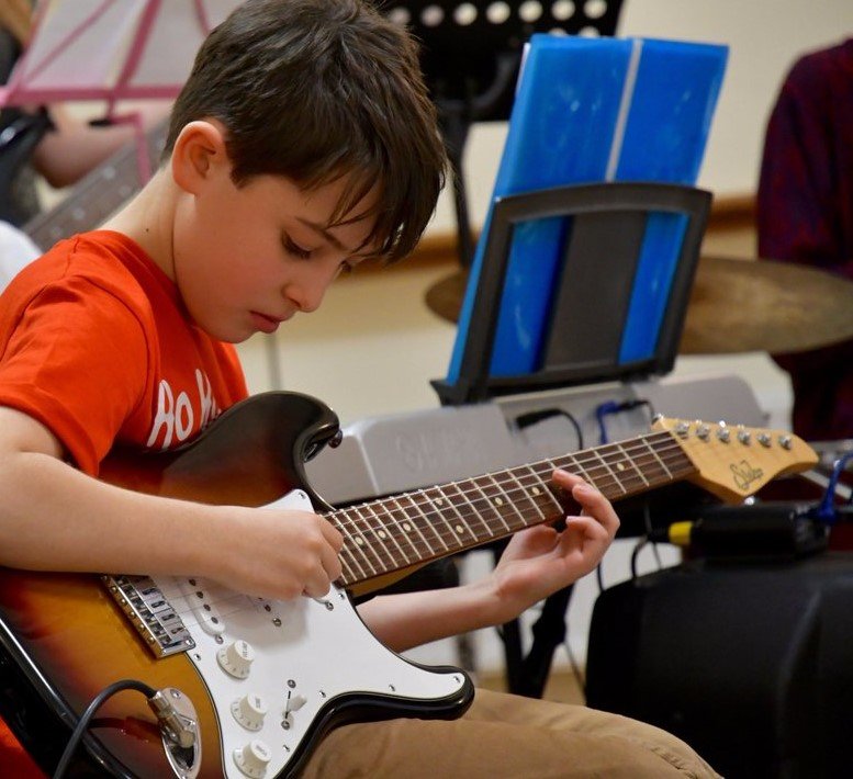 Boy playing guitar