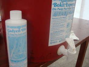 Gadyen Dlo bottle and labeled bucket