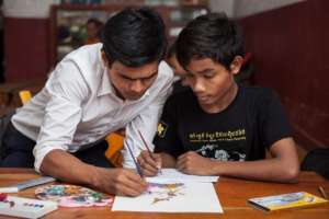 Champey art student with teacher