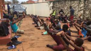 Zani (left) teaching other refugee children