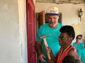 St. Thomas Recovery Team celebrates a new home