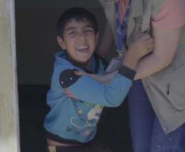 A Syrian refugee child and beneficiary of our work