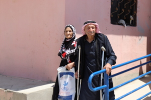 Syrian refugee couple uses a new ramp