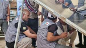 Trainees learn to install a solar panel