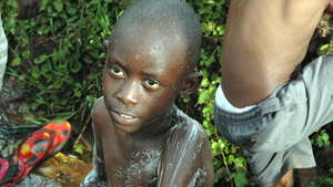 Pupils taking bath at the river
