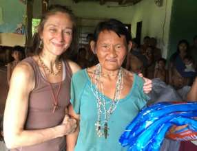 Eglee celebrates with a community elder in Iguana