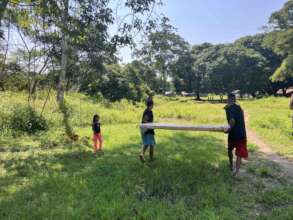 Carrying the panels from the river to the clinic