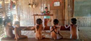 The youngest students in class with their primers